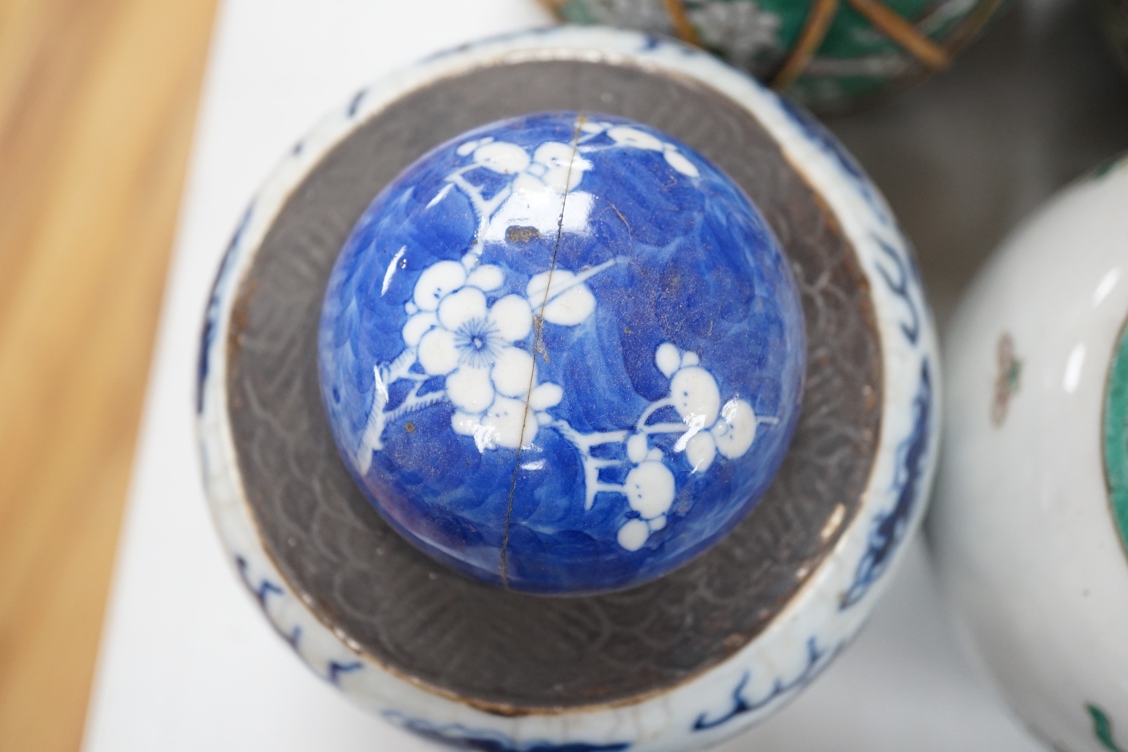 A collection of 19th and 20th century Chinese jars and covers and a blue and white vase and cover, vase 32cms high